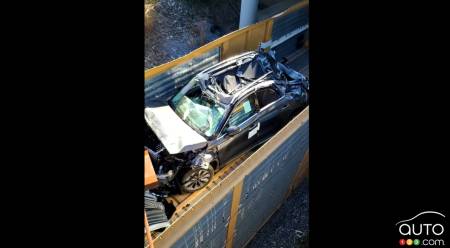 A destroyed SUV in one of the train cars